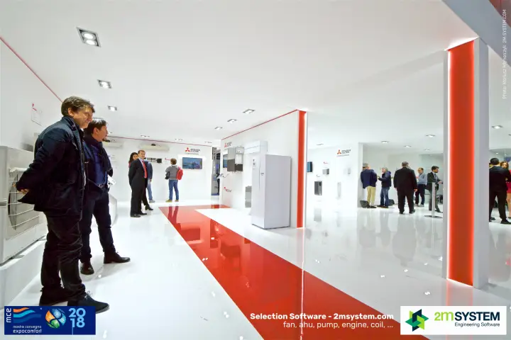 Visitors studying Mitsubishi Electric outdoor units along the red-striped walkway at MCE 2018