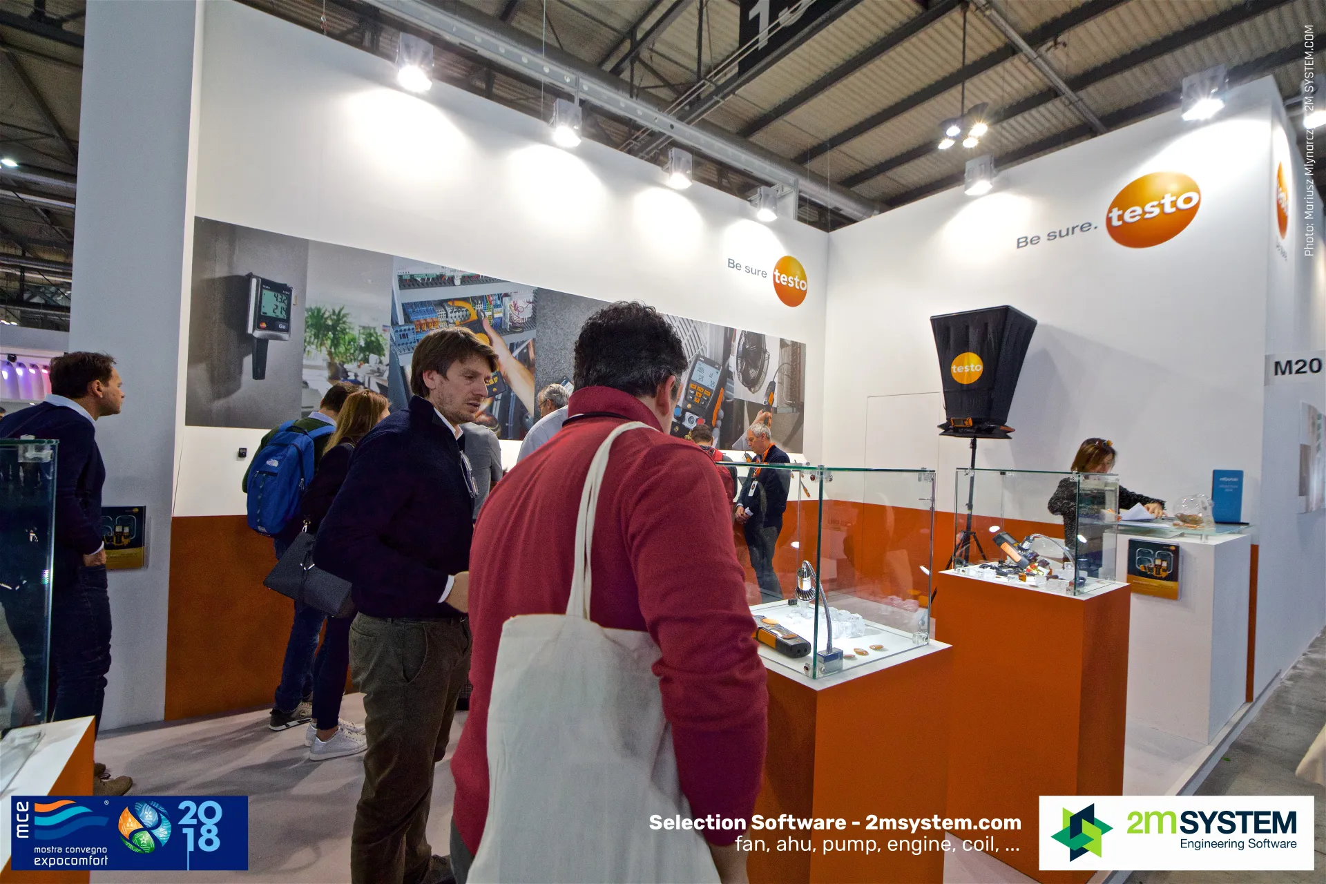 Visitors at Testo glass showcases with measuring instruments at MCE 2018