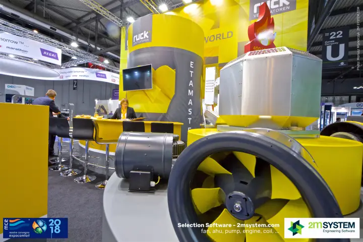 Yellow impeller of a Ruck inline fan with roof fan and bar behind