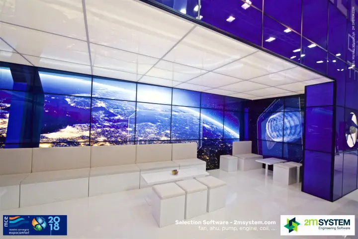 Ziehl-Abegg lounge with white seating and earth-view video wall