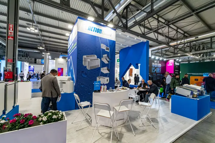 Action Clima meeting area with curved counter and folding bar stools at MCE 2024
