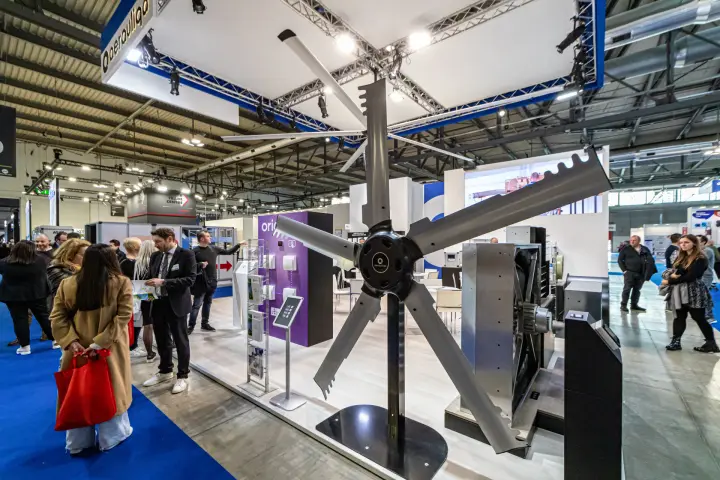 Aerauliqa large-diameter fan rotor with serrated blades on a floor stand at MCE 2024