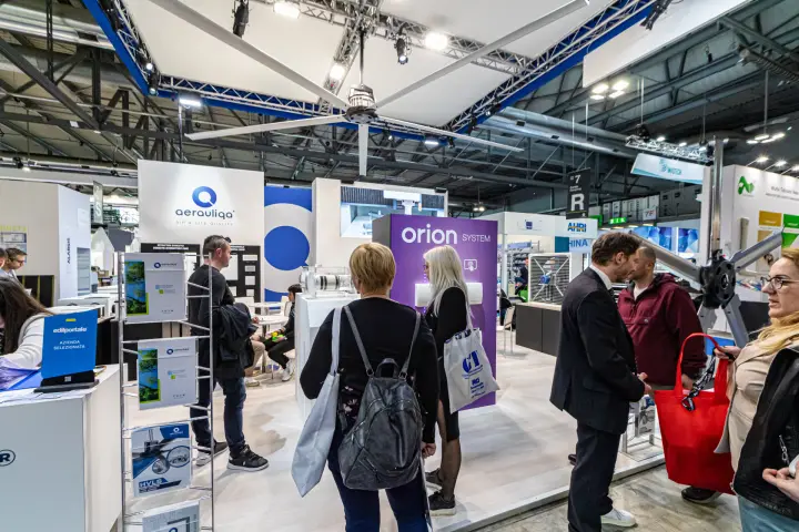 Aerauliqa stand with HVLS ceiling fan and purple Orion System column at MCE 2024