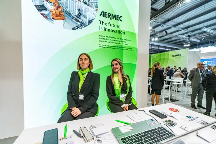 Aermec welcome desk with 'The future is innovation' backlit wall at MCE 2024