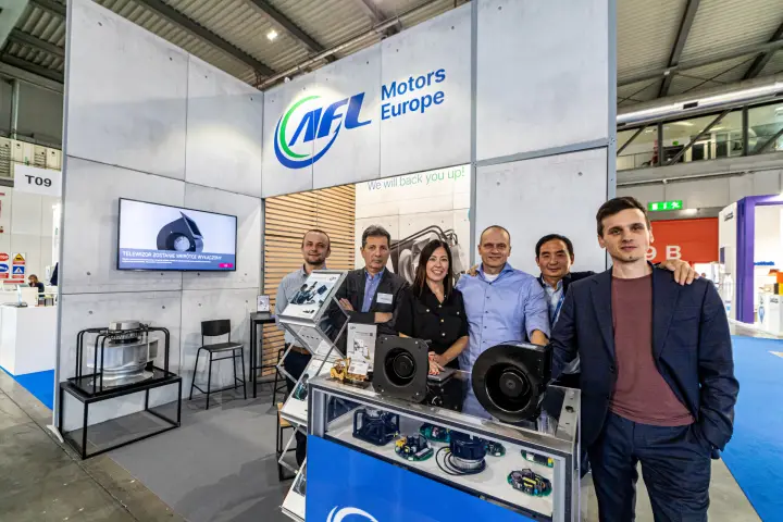 AFL Motors Europe team behind the blower and motor showcase at T09 at MCE 2024