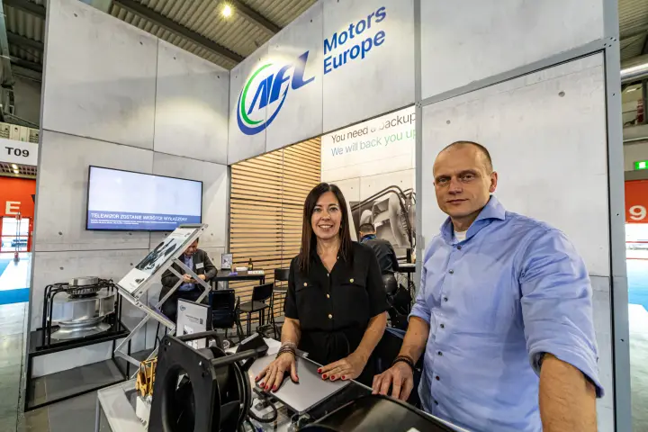 AFL Motors Europe team behind a counter of blowers and fans at MCE 2024
