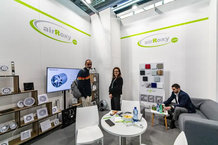 airRoxy stand with bathroom fans and the aRw industrial fan on screen at MCE 2024