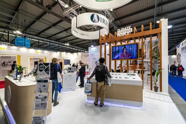 Airzone stand with suspended ring sign and climate control counters at MCE 2024