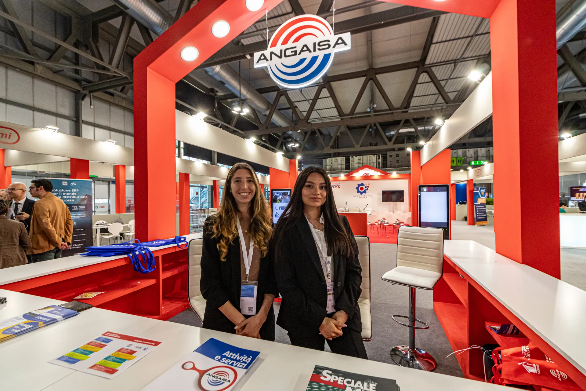 Angaisa reception under a red portal with illuminated logo at MCE 2024