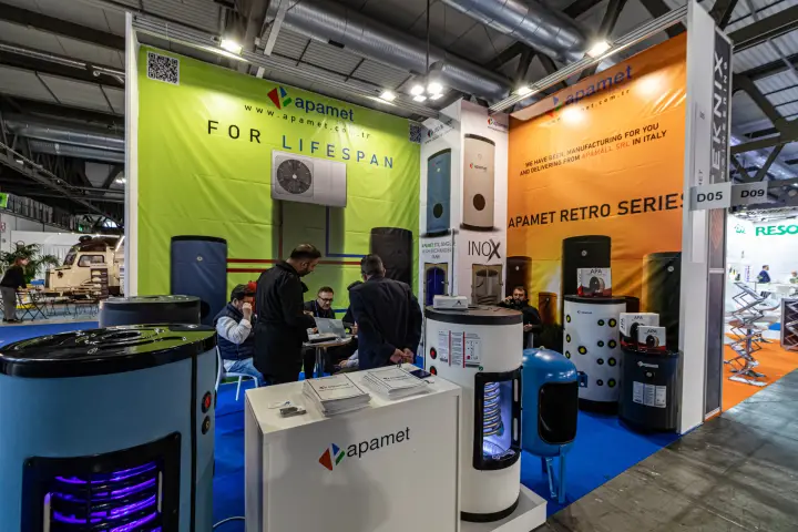 Apamet stand with hot water storage tanks and 'For Lifespan' backdrop at MCE 2024