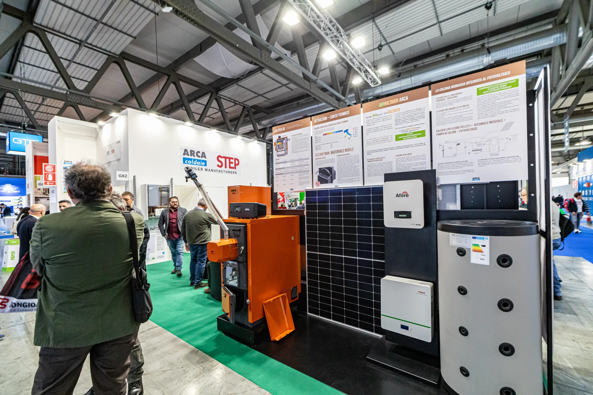 Arca pellet boiler shown with PV panel, inverter and storage tank at MCE 2024