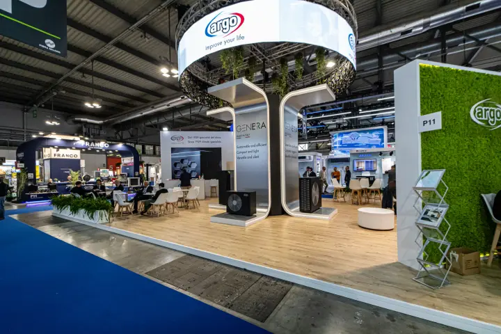 Argo GENERA heat pumps under the ring banner beside a moss wall at MCE 2024