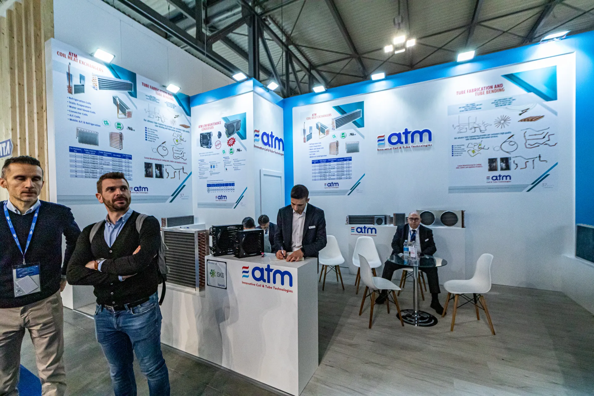 ATM counter with coils and compact condensers beside product posters at MCE 2024