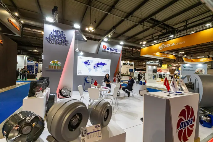 Ayas stand with inline duct fans, axial fans and a world map graphic