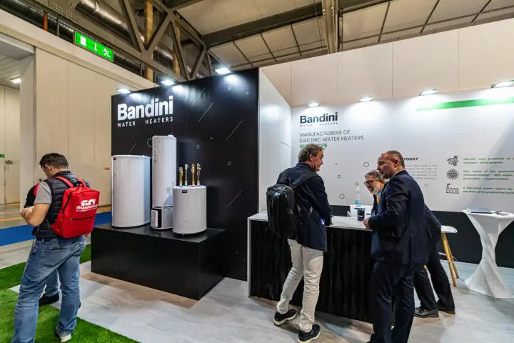 Bandini electric water heaters on a black plinth beside the reception counter
