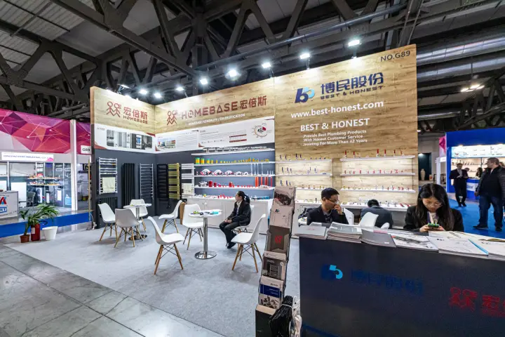 Best & Honest reception counter and brass valve shelves at booth G89