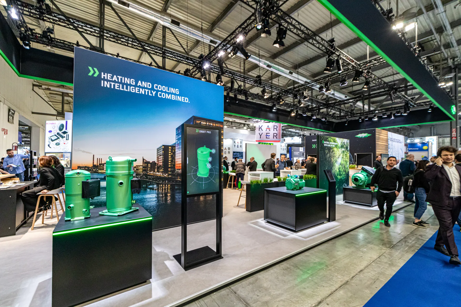 Bitzer stand with green compressors and Orbit Pro display along the aisle at MCE 2024