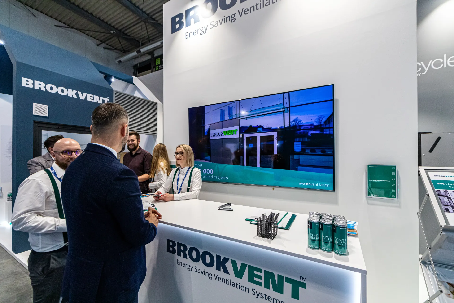 Brookvent counter with #wedoventilation video and Power Breath cans at MCE 2024