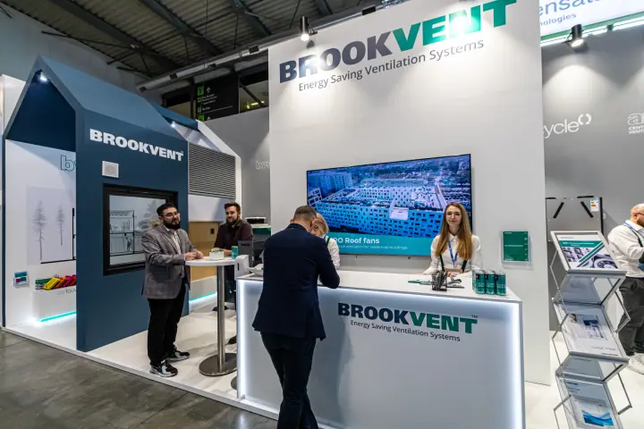 Brookvent reception counter with roof fan video on the wall screen at MCE 2024