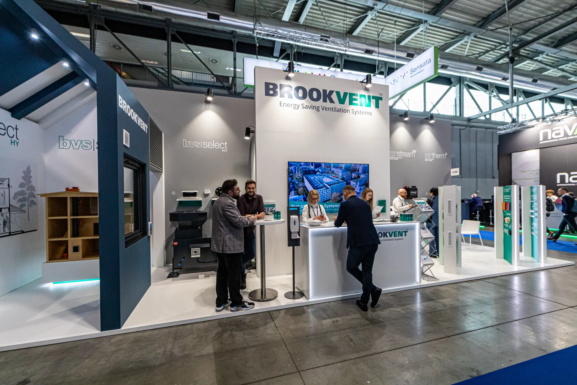 Brookvent stand with house-shaped structure and dollhouse model at MCE 2024