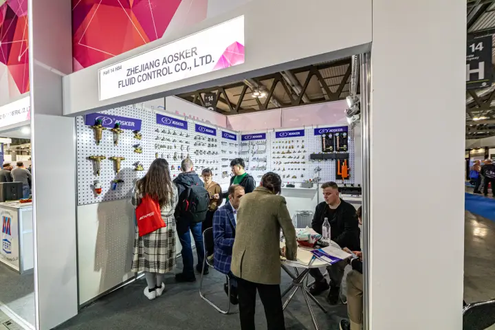 Busy Aosker booth with pegboard of valves, filters and pump groups