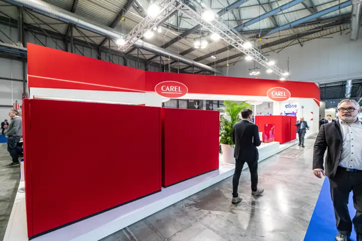 Carel stand exterior with red felt panels and oval logos