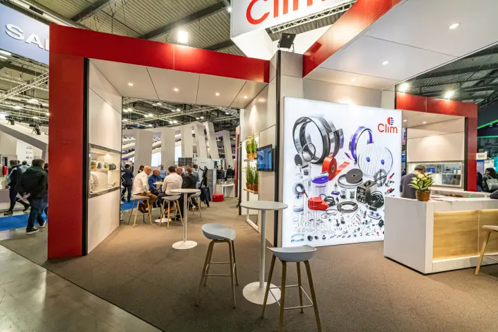 Climatech lounge beside a backlit Clim accessories panel at MCE 2024