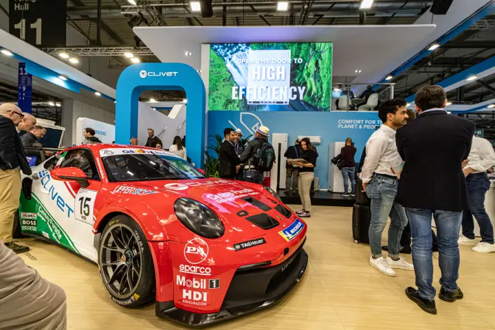 Clivet race car display under the 'Open the door to high efficiency' screen at MCE 2024