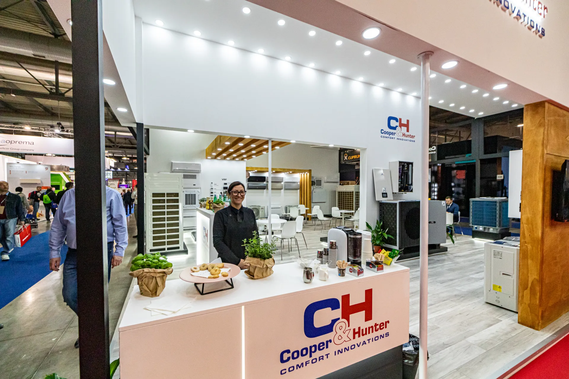 Cooper&Hunter coffee counter with VRF units and heat pumps behind at MCE 2024