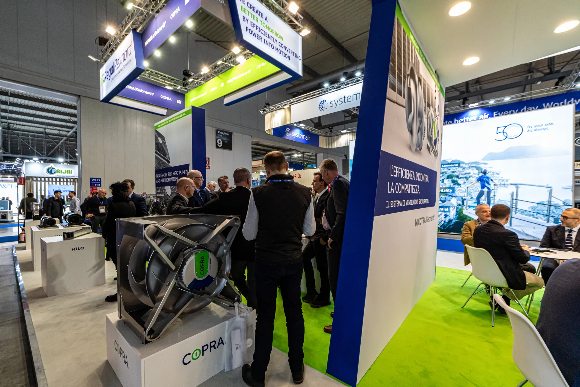 COPRA plug fan in front of a busy Regal Rexnord stand at MCE 2024