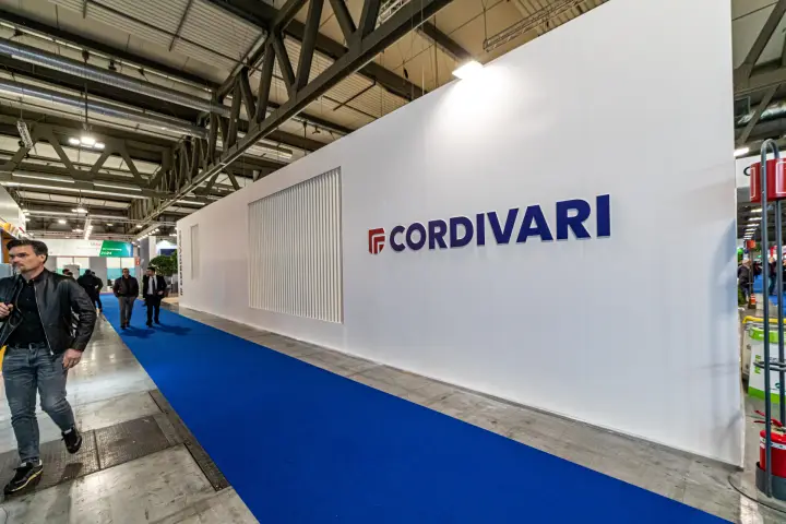 Cordivari stand's long white wall with large logo along the aisle