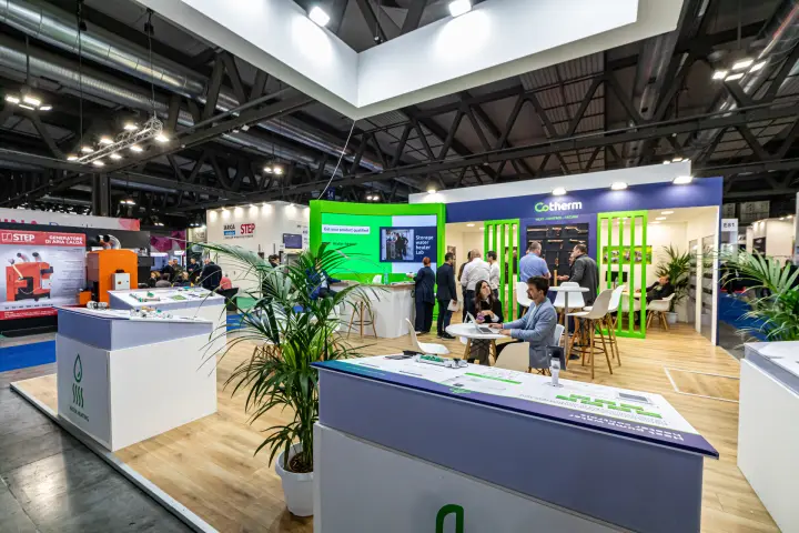 Cotherm stand with water heating counters and green screen wall at MCE 2024