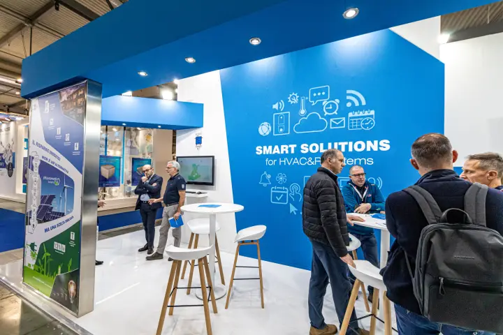 Criotherm meeting area with tall tables under the SMART SOLUTIONS wall at MCE 2024