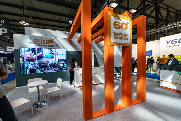 Cubigel orange 60+ years frame and video wall of compressor assembly at MCE 2024