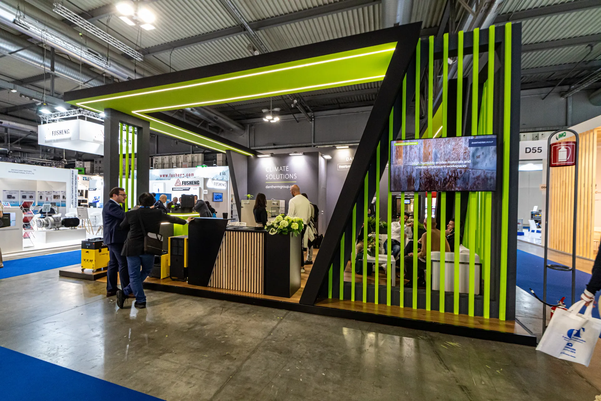 Dantherm Group stand with lime green slats and 'Climate Solutions' wall at MCE 2024