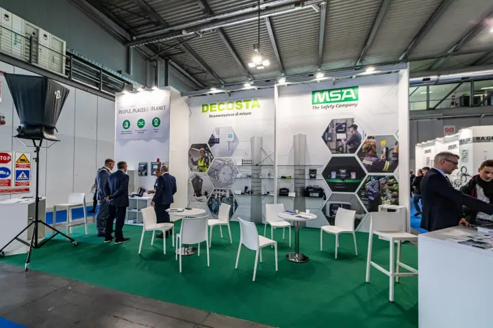 Decosta and MSA stand with measuring instruments on green carpet at MCE 2024