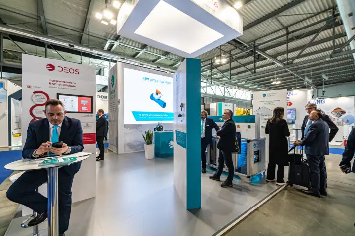 DEOS and Regin Group stand with new Vortex Flow Meter on LED screen at MCE 2024