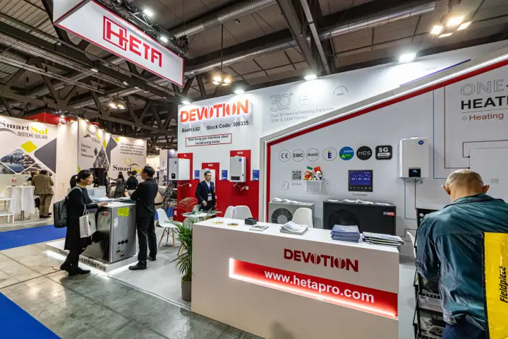 Devotion counter with hetapro.com light strip below a hanging Heta sign at MCE 2024