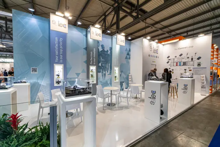 Eatec stand with valve showcases and an 'Our Control Loop' wall at MCE 2024