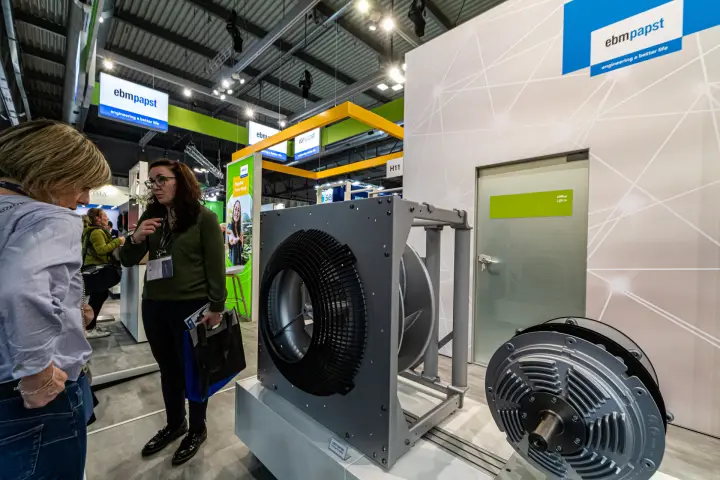 ebm-papst plug fan in a steel frame next to an exposed motor at MCE 2024