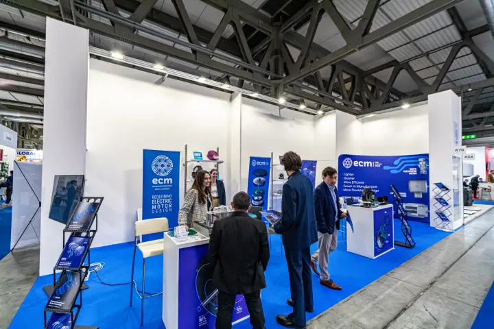 ECM stand with "Redefining Electric Motor Design" banner and samples at MCE 2024