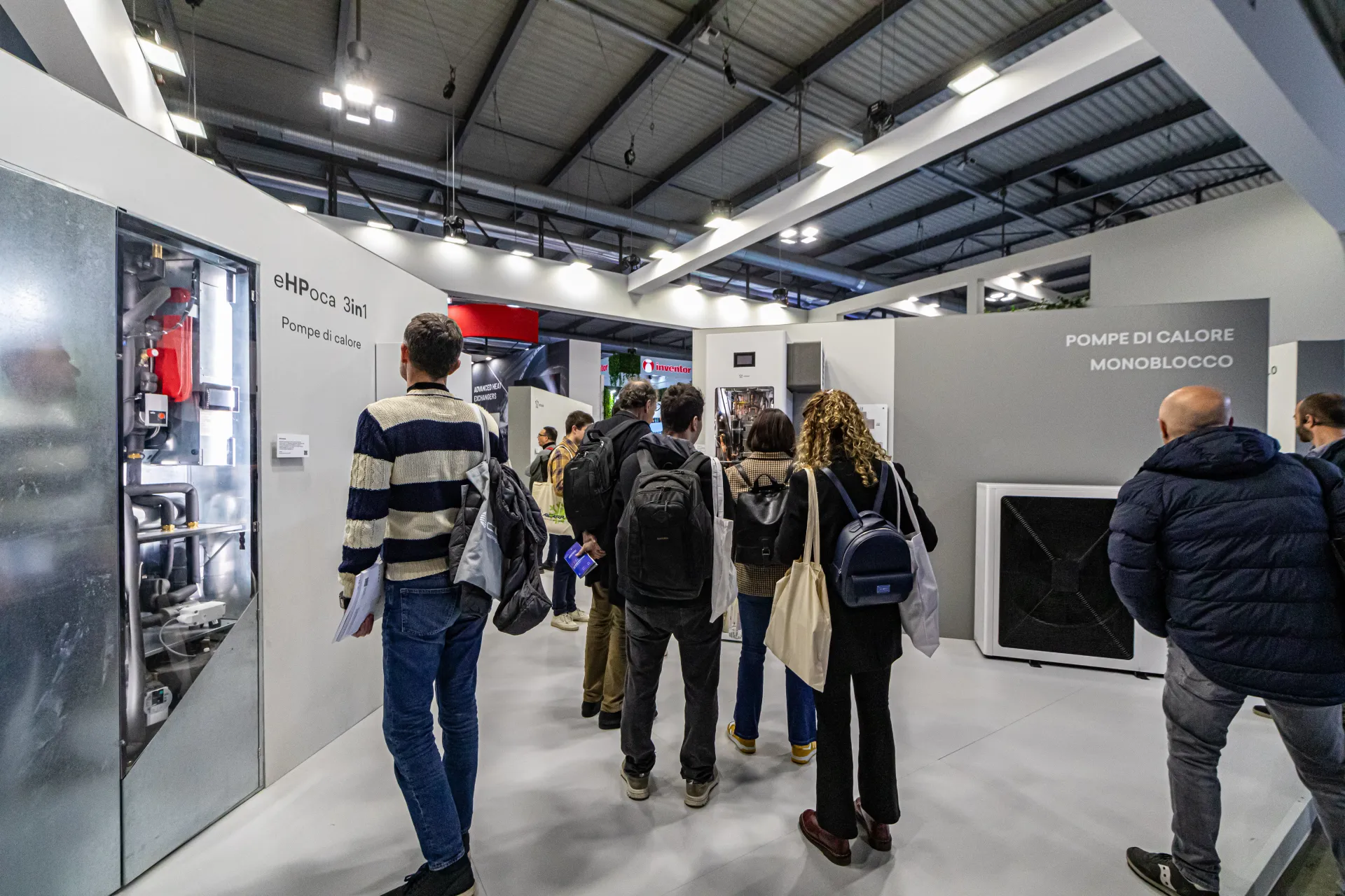 eHPoca 3in1 heat pump with open front beside monobloc units at MCE 2024