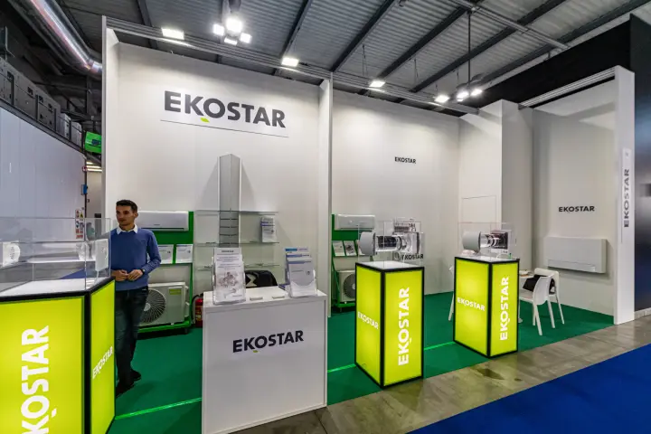 Ekostar stand with split air conditioners and lit lime-green plinths at MCE 2024