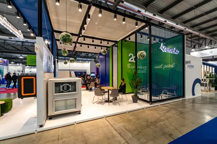Eneko stand with air handling unit and slatted green-blue meeting area at MCE 2024