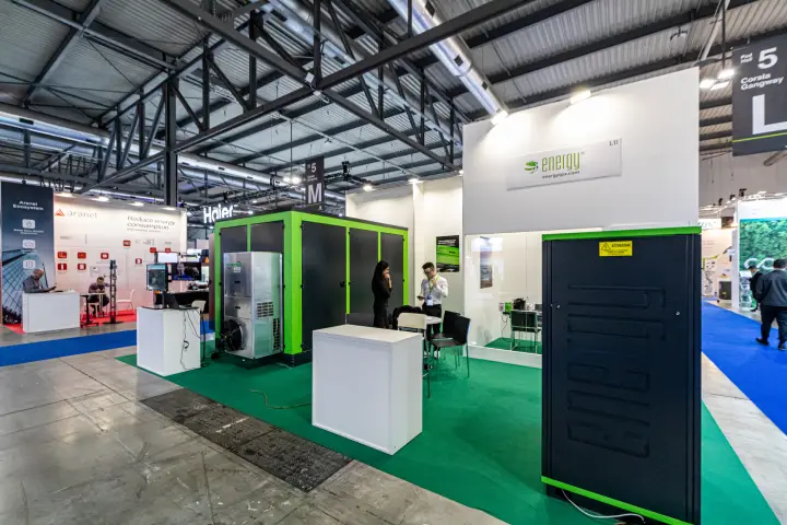Energy stand L11 with green-framed enclosure and black equipment cabinet at MCE 2024