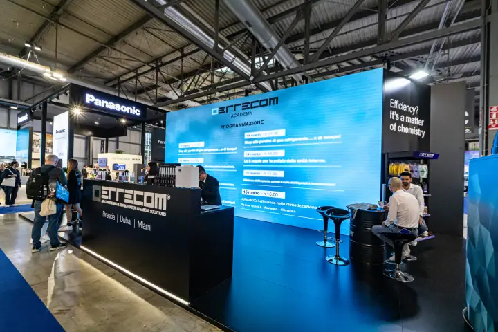 Errecom stand with LED wall listing its Academy talk schedule