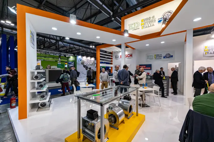 Euro Motors Italia stand with blower display and visitor lounge at MCE 2024