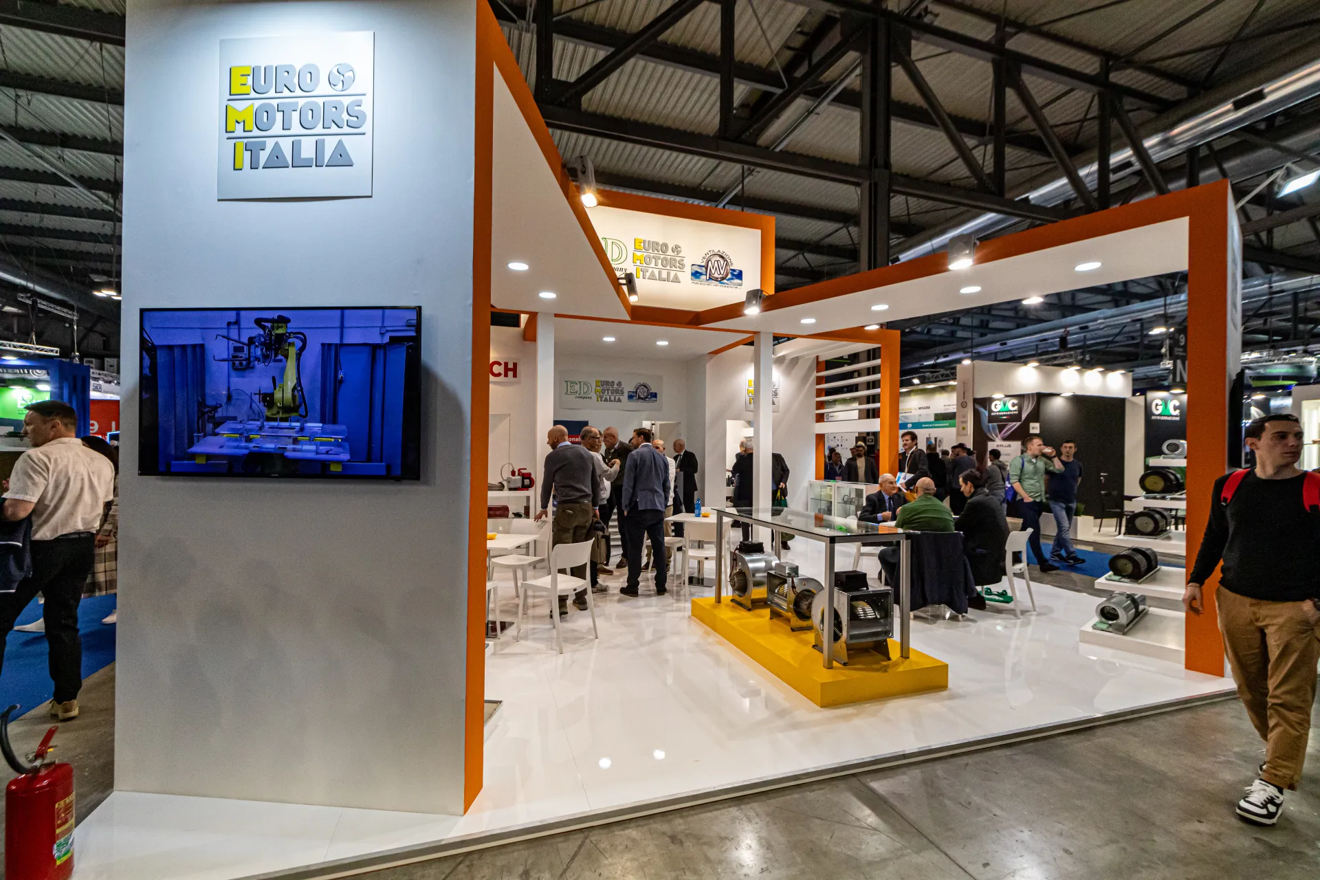 Euro Motors Italia stand with centrifugal blowers on a yellow plinth at MCE 2024