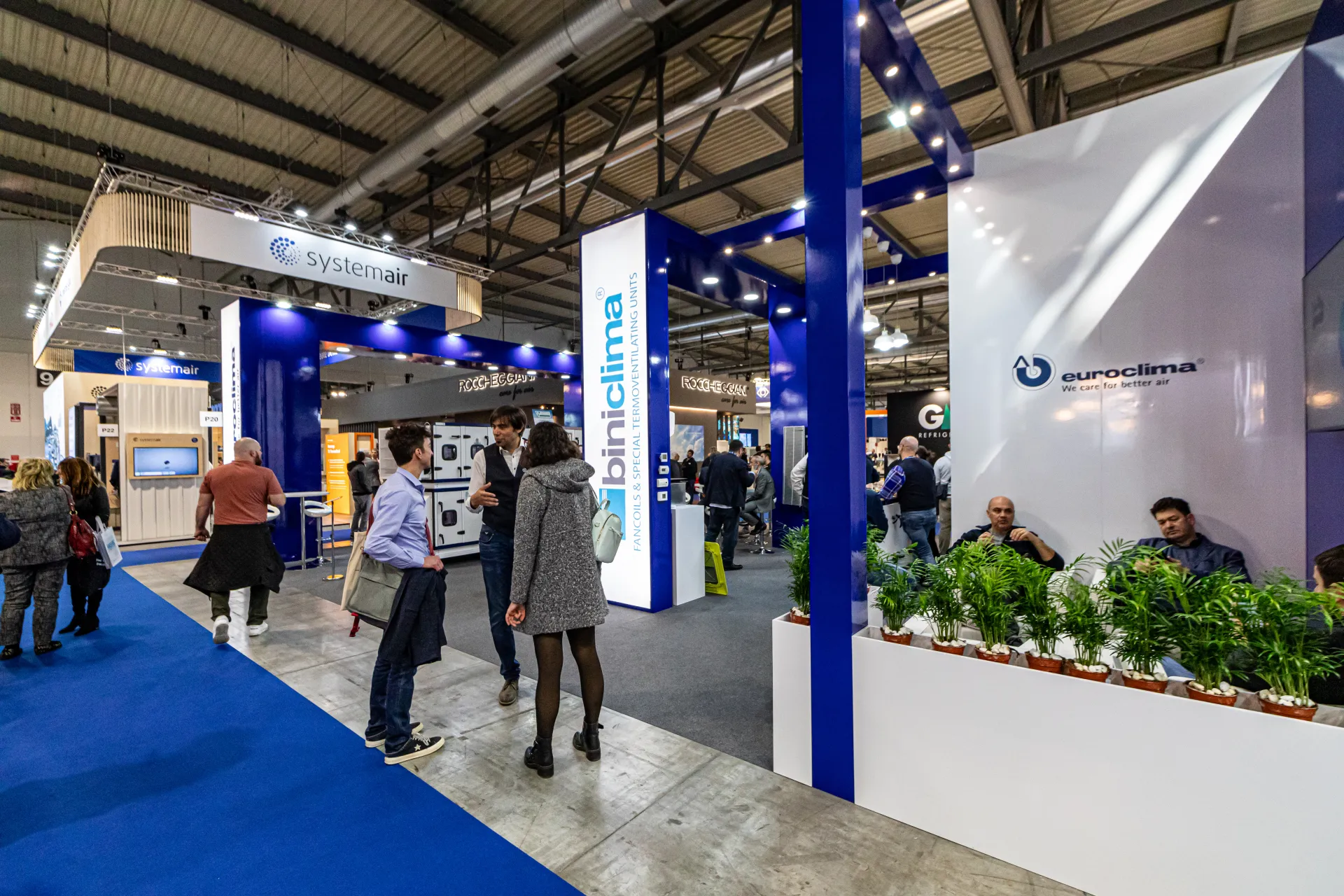 Euroclima lounge with planters next to the backlit Biniclima column at MCE 2024