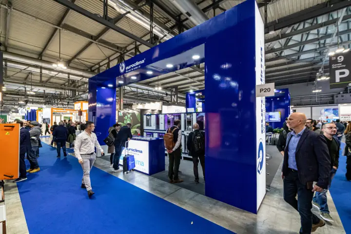 Euroclima stand P20 framed by glossy blue portals beside a blue aisle at MCE 2024